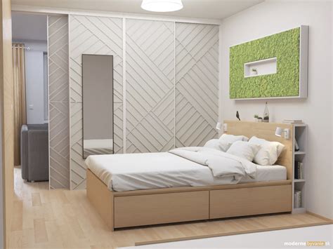 Detail interiéru hosťovskej izby so smaragdovo zelenými prvkami a tmavým drevom