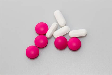 Žena užívajúca tabletky