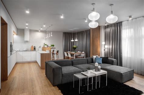 Moderný otvorený bytový priestor s kuchyňou, jedálenským kútom a obývacou izbou