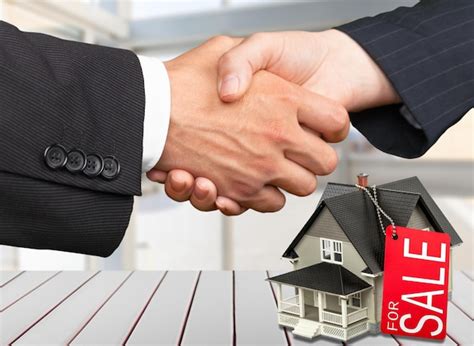 People shaking hands in a real estate office